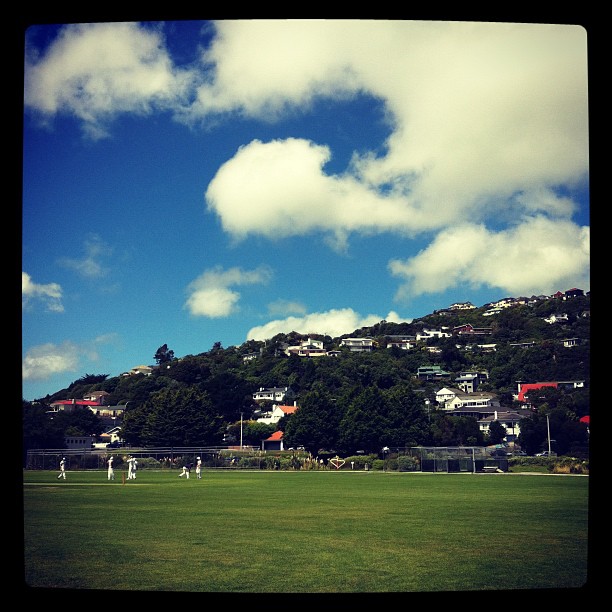 Instagram Photo of playing Cricket with hills in the back